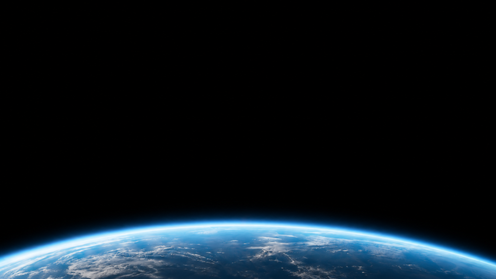 The curved horizon of Earth beneath deep black space